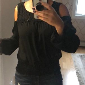 Black tunic with open shoulders.